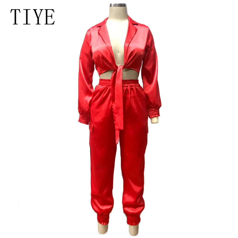 TIYE Elegant Satin Bodycon Bandage Jumpsuit Women 2019 Autumn Long Sleeve Solid Lapel Deep V Neck Pockets Playsuits Streetwear TIYE Elegant Satin Bodycon Bandage Jumpsuit Women 2019 Autumn Long Sleeve Solid Lapel Deep V Neck Pockets Playsuits Streetwear