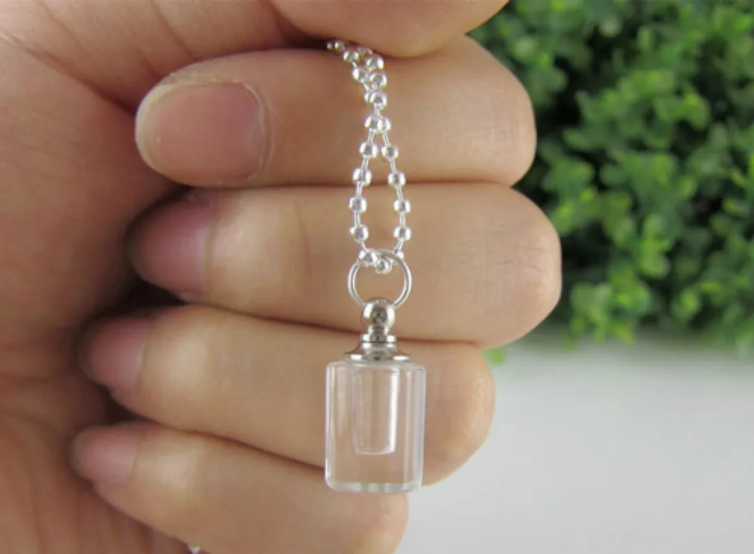 

Small cylindrical peach heart crystal perfume bottles fashion sweater necklace female screw essence oil lanugo hair pendant tran