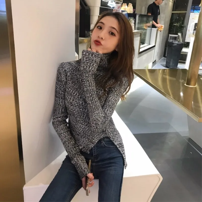 Sweater women's autumn and winter new fashion wild slim slimming sweater women's hem irregular solid color pullover sweater