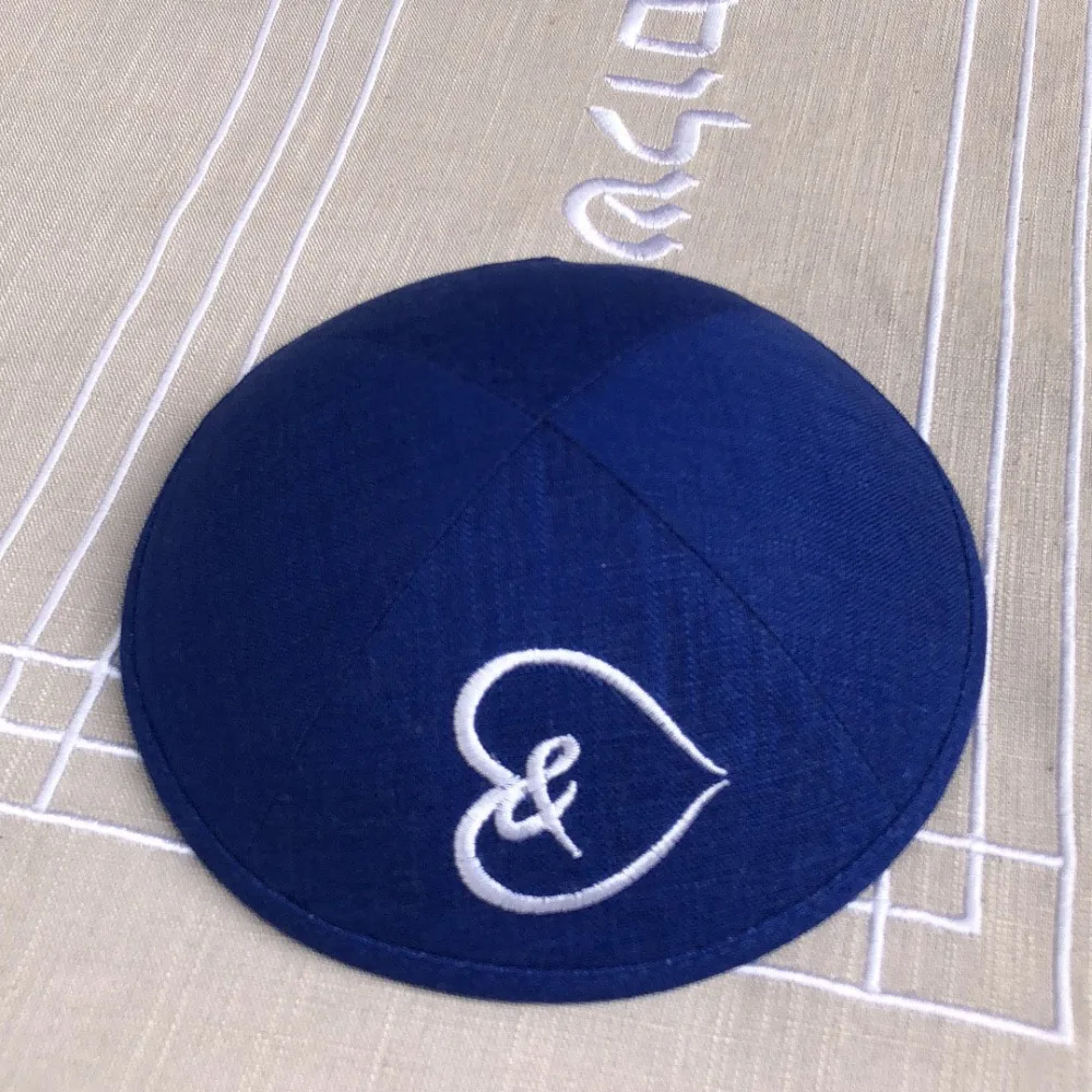 

Royal blue linen kipas with white embroidery logo as clients' design