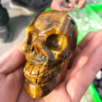 

Natural yellow tiger eye stone hand-carved skull as a home decoration