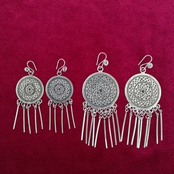 

Guizhou Miao handmade jewelry national wind handmade Miao earrings traditional pinch fillet copper drum tassel earrings