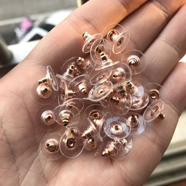 https://ae01.alicdn.com/kf/HTB17_xkKSzqK1RjSZFLq6An2XXan/100pcs-DIY-Craft-Accessories-Silicon-Stud-Earring-earrings-Back-Stoppers-Ear-Post-Nuts-Jewelry-Findings-Components.jpg