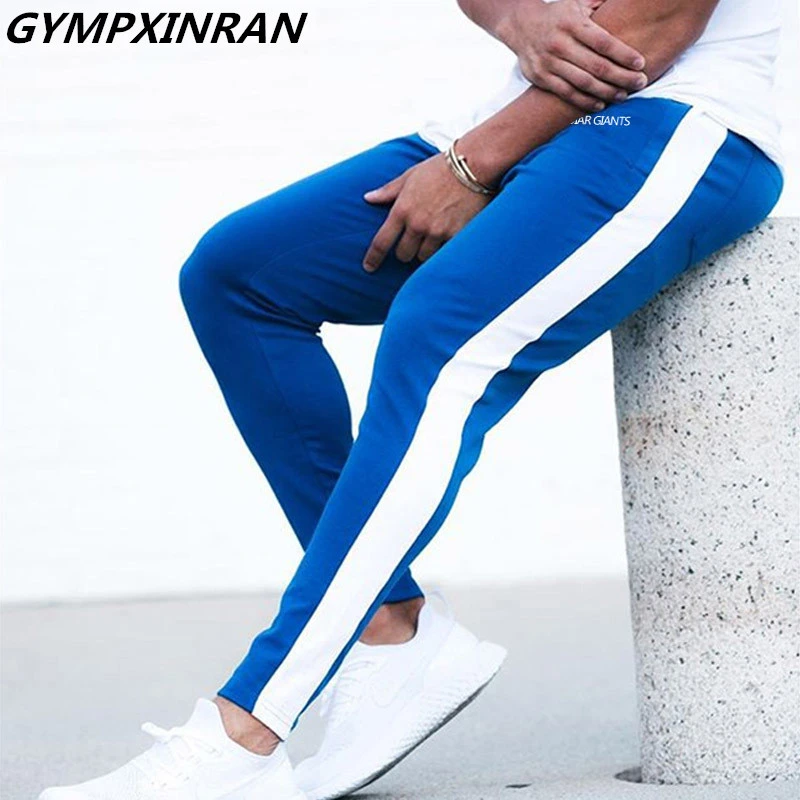 GYMPXINRAN جديد الرجال السراويل الهيب هوب اللياقة البدنية الملابس ركض Sweatpants الجانب شريط الأزياء الكلاسيكية الشارع الشهير السراويل الترنك السراو...