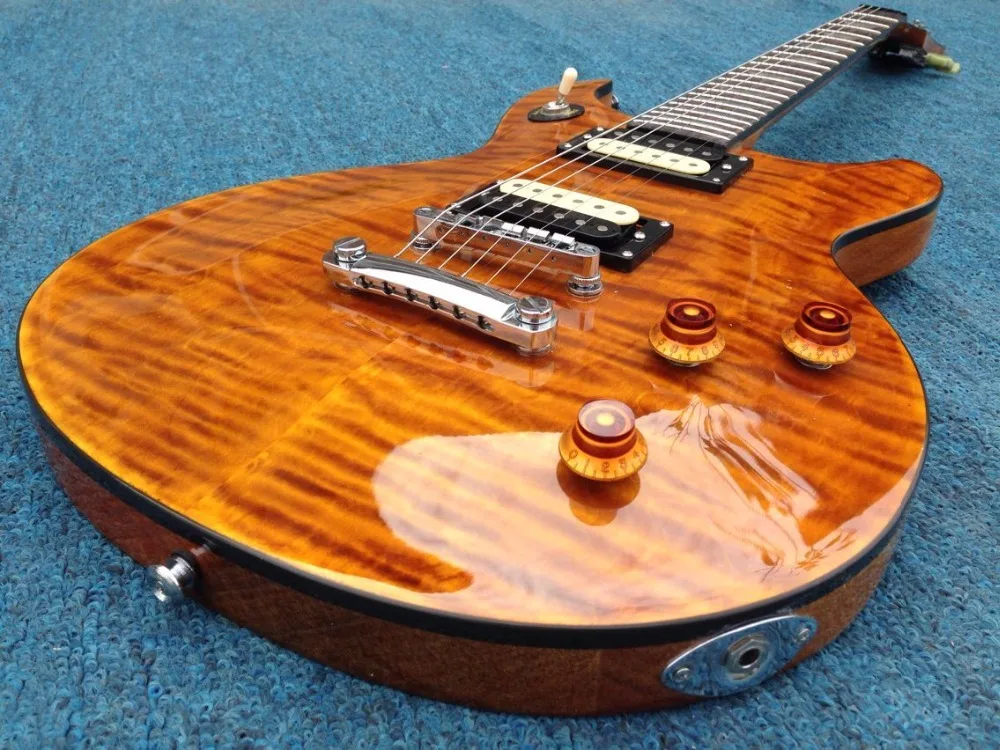 

ABALONE  inlay ,AAA grade Flamed maple top ,black binding ,PRS electric guitar