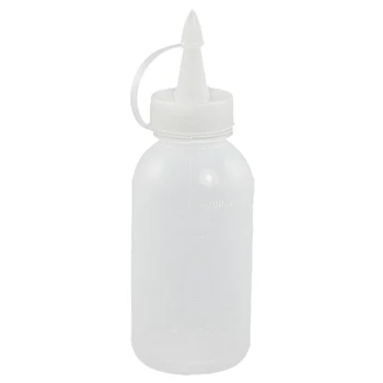 

Sewing machine oil bottle made of clear, white plastic 100ml spray nozzle