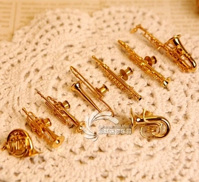 

Gilded Sax, trumpet, horn, flute, tuba, bassoon, Oboe, clarinet model brooch