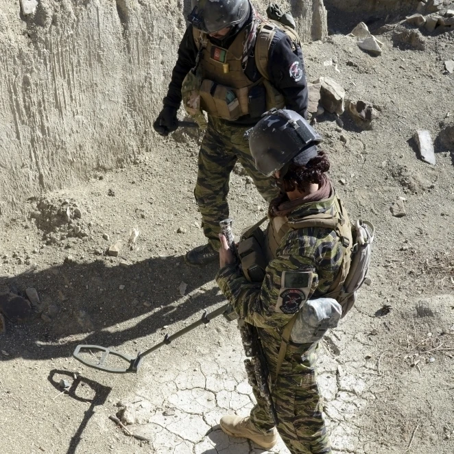 Afghan National Security Forces members search for IED's Poster Print (22 x 34)