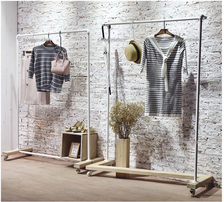 Clothing store display rack. Clothes rack women's shop floor-to-floor hangers. Solid wood Textile Gondola simple white gantry.