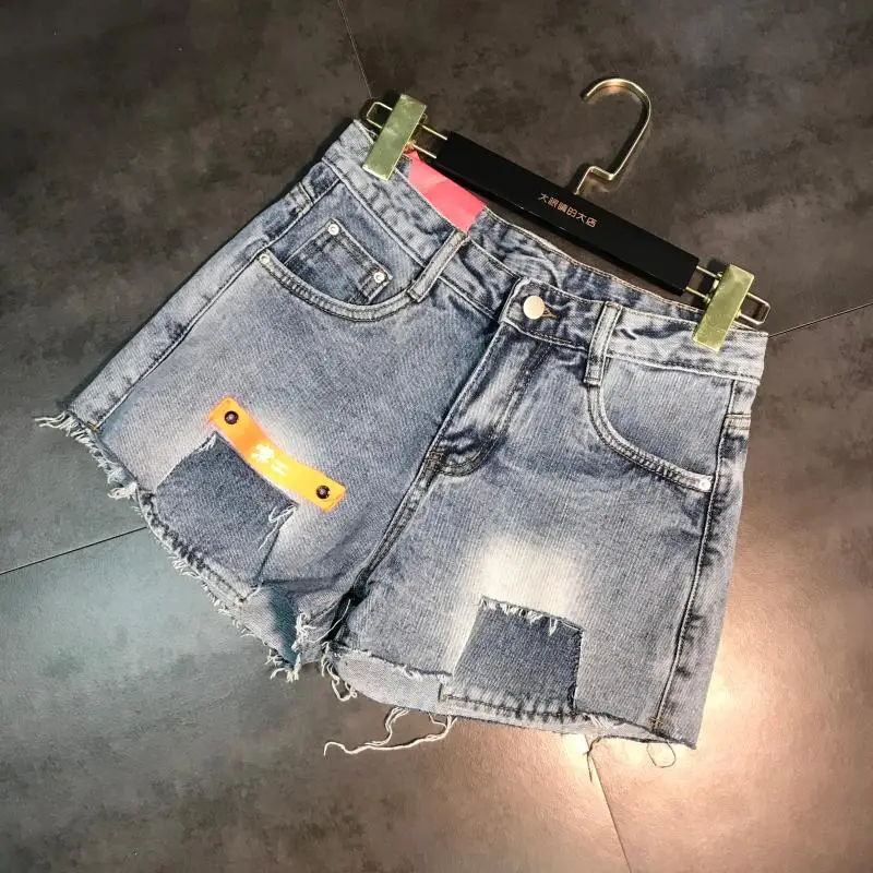Summer New Bar Code Cloth Decoration Hole Burr HotPants Denim Shorts Female Tide