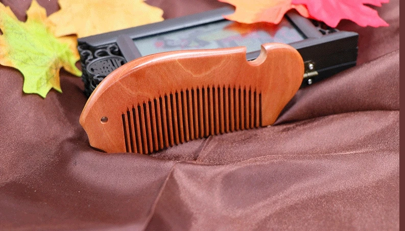 

Fine fish carded hot style sandalwood comb
