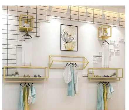 Clothing store display rack wall women's shop wall hanging hangers gold clothing rack side hanging combination.