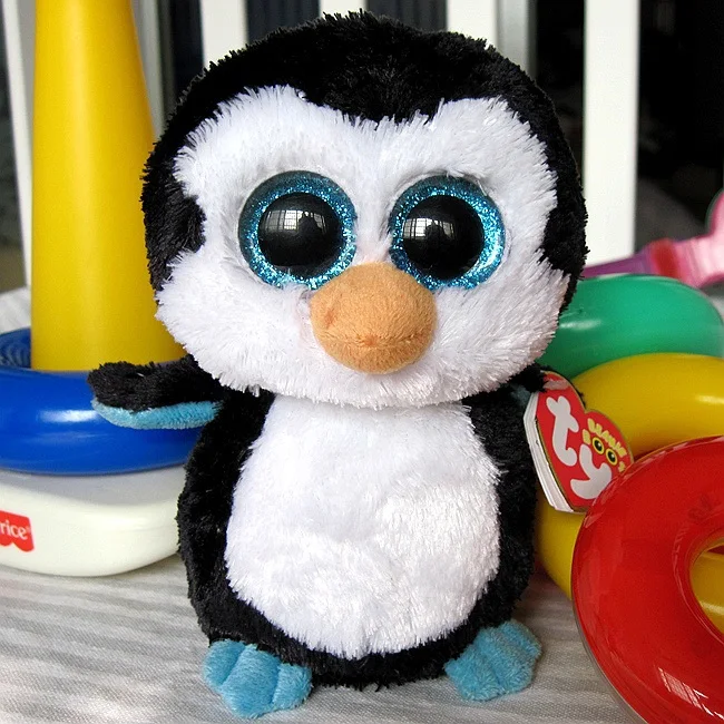 peluche pingouin gros yeux
