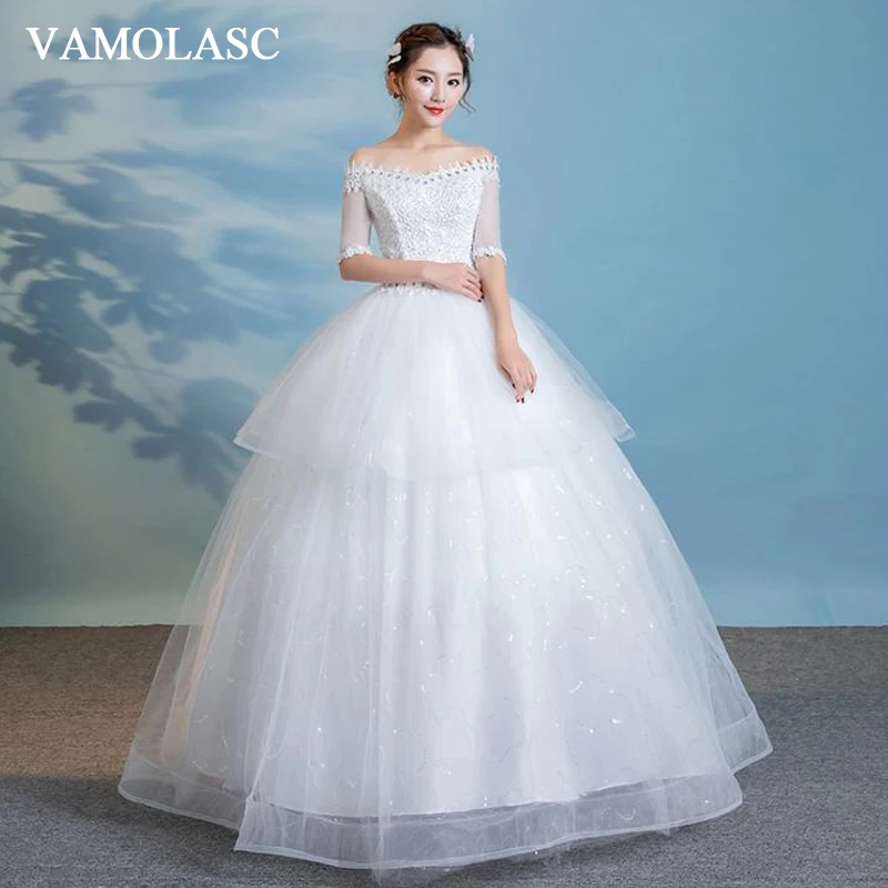 

VAMOLASC Crystal Boat Neck Tiered Lace Ball Gown Wedding Dresses Illusion Pearls Half Sleeve Backless Bridal Gowns