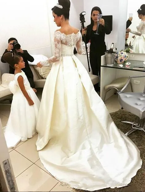 ivory-a-line-wedding-dresses-lace-beaded-off-the-shoulder-sheer-long-sleeves-bridal-gowns-back-covered-buttons-satin-sweep-train-vestidos (2)_