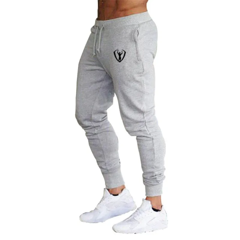 رجل ركض سراويل تقليدية اللياقة البدنية الذكور الرياضية الأزياء القيعان نحيل Sweatpants بنطلون أسود صالات رياضية ركض السراويل الترنك