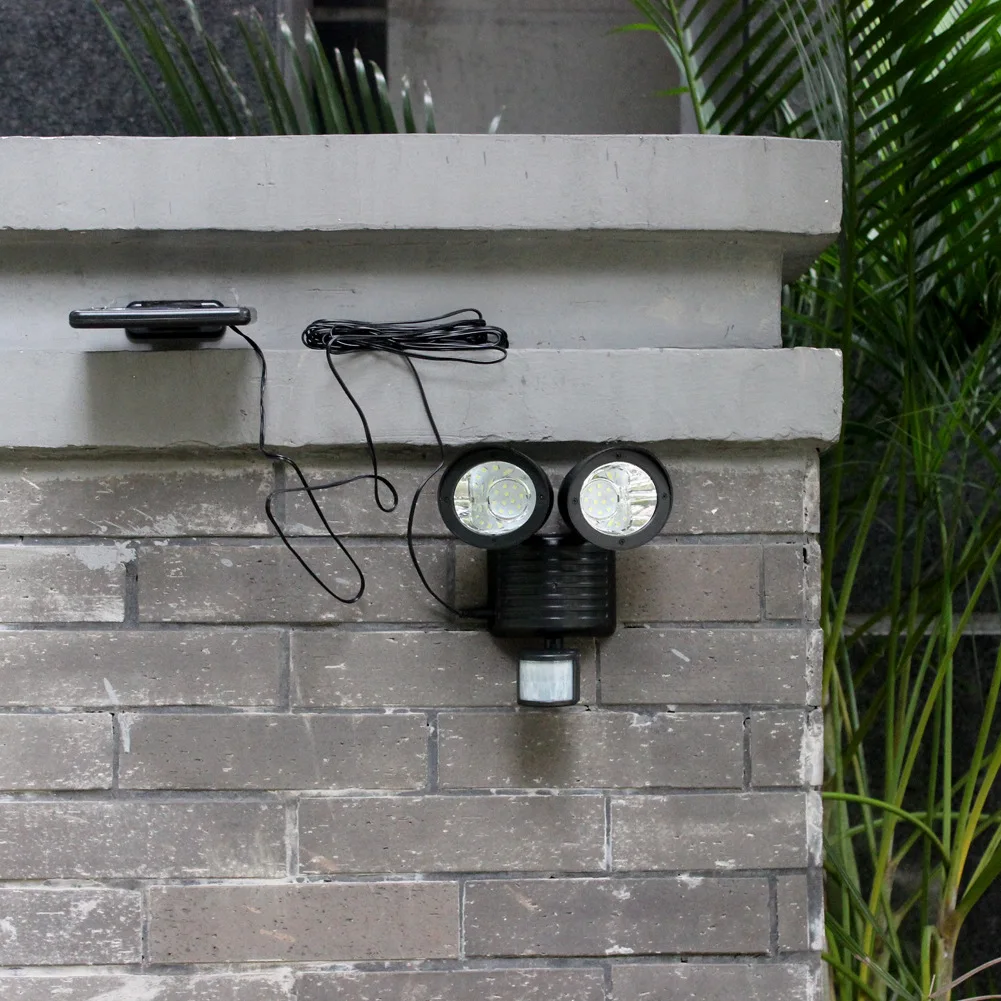 

High quality polysilicon solar induction wall light human body induction spotlight 22LED double head garden wall light