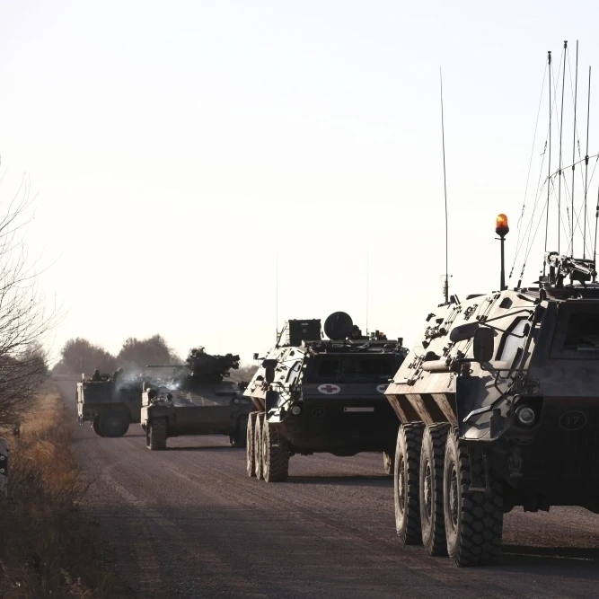 A convoy of German Army TPz Fuchs armored personnel carriers Poster Print (17 x 11)