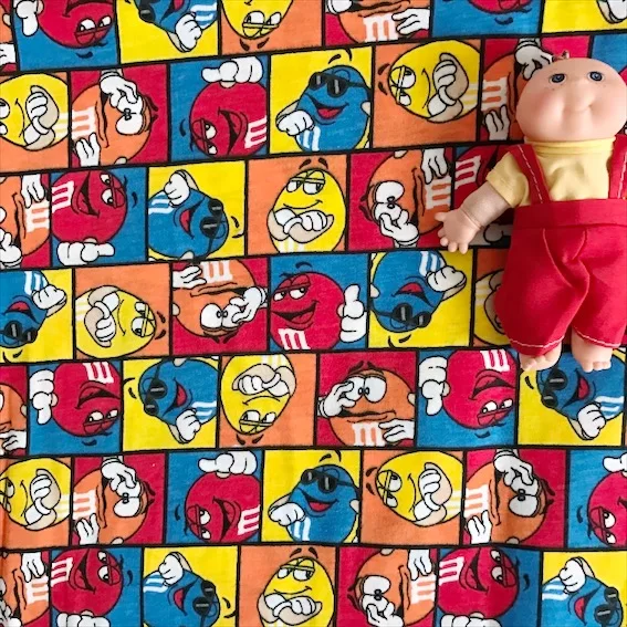 

Cartoon MM Chocolate Bean Elasticity Knitted Cotton Fabric For Sewing Quilting Patchwork Children Baby Colth Texitle