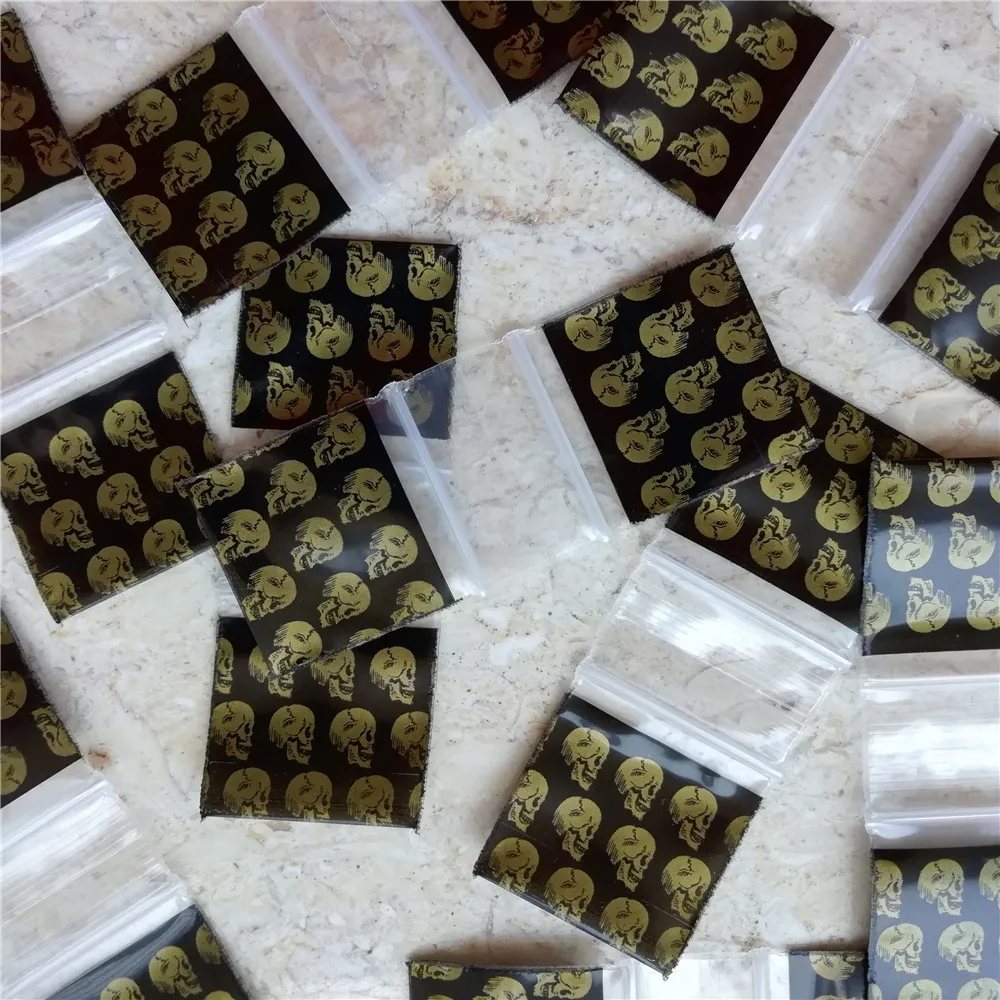 100pcsGoldenSkullsBaggies5milSealthebonebag1x1InchMini