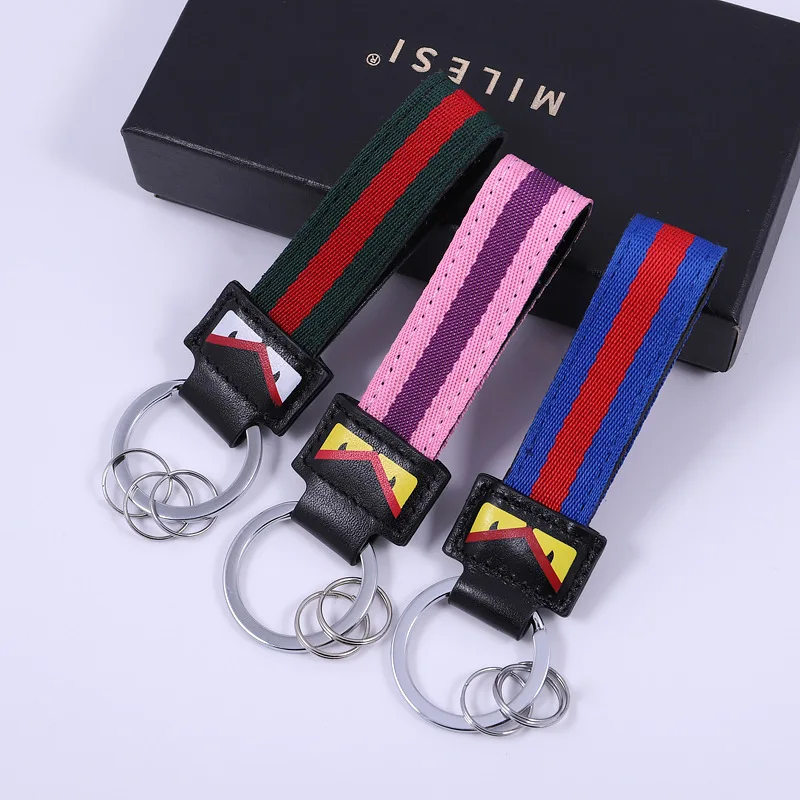 

Red and green bar car key chain men and women waist key chain cartoon small monster eye key chain fashion gift box pendant A182