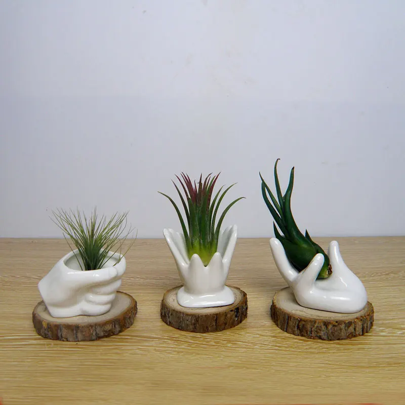White ceramic hands shelf for flowers desktop decoration 