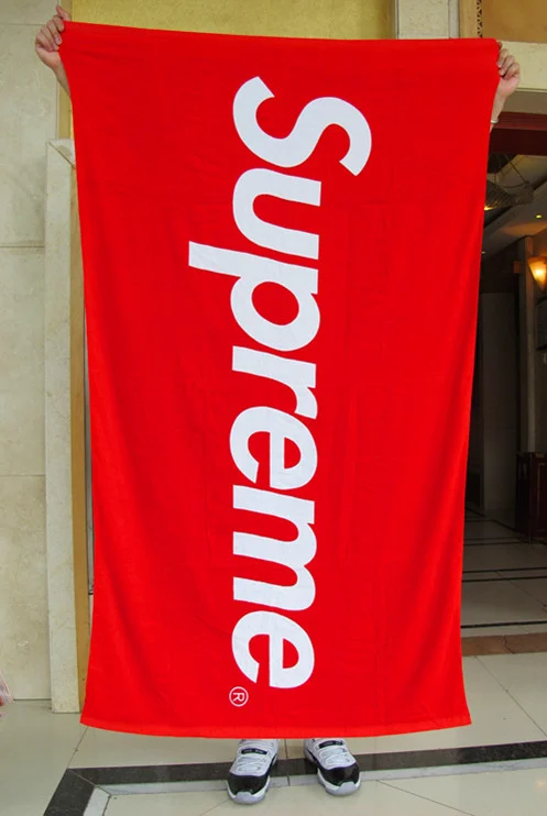 Supreme beach towel blanket on the bed 