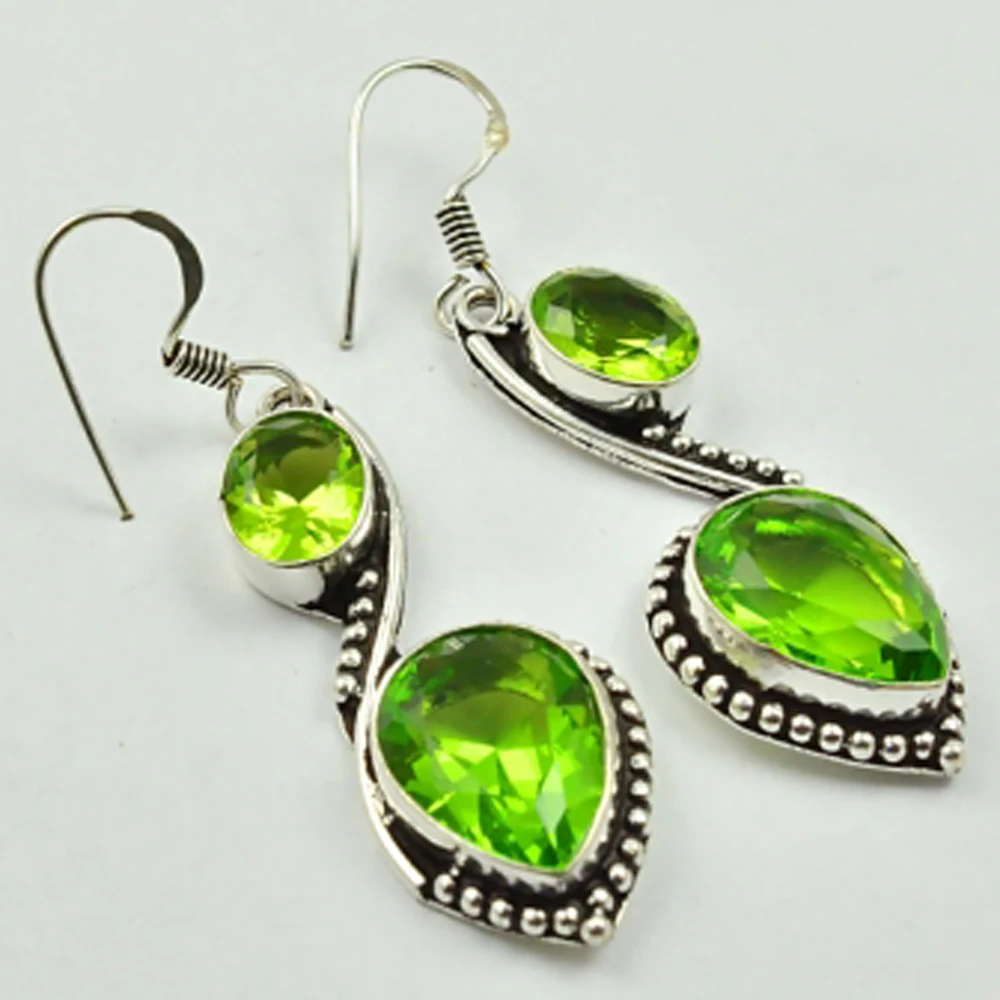 

Peridots , Silver Overlay on Copper Earrings, 55 mm , E2401
