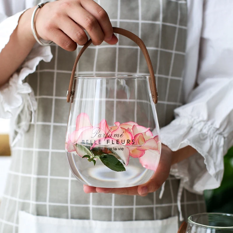 

HOT Unique Chic Nordic Glass Storage Jar Bottle With Leather Handle Minimalist Desk Storage Bottle Organizer Flower Vase Conta