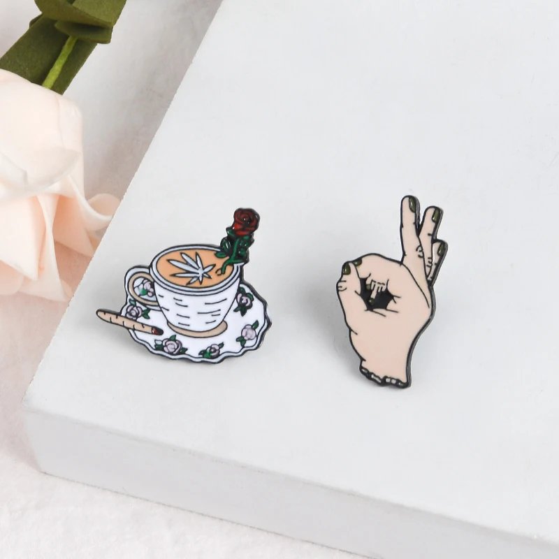 

Weird hand Coffee Pin"It's OK"Infinite loop hand Cigarettes and Rose Enamel brooches Fashion Jewelry Badges Gifts