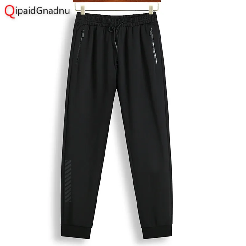 

Men Pants Solid Big Size 4XL Pockets Elastics Trousers Narrow Feet Mid Rise Tapered Clothing Man Stretchy Pants 2018 Autumn