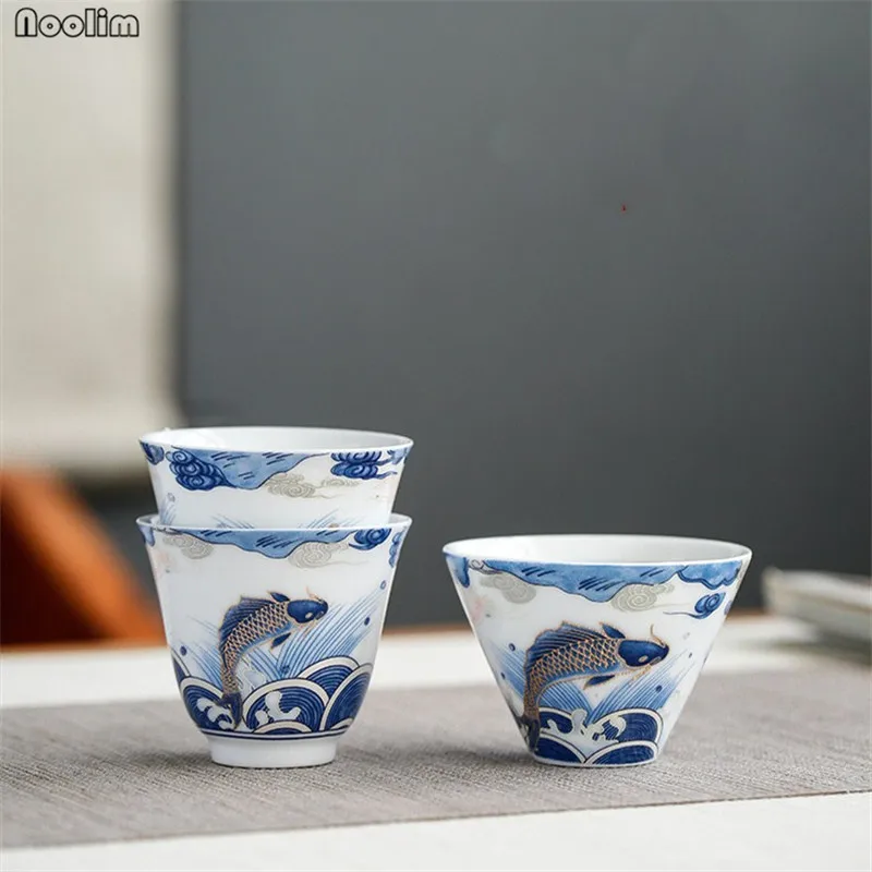 

NOOLIM Hand-painted Auspicious Arowana Ceramic Small Tea Cup Home Kung Fu Tea Set Handmade Tea Bowl Drinkware Accessories