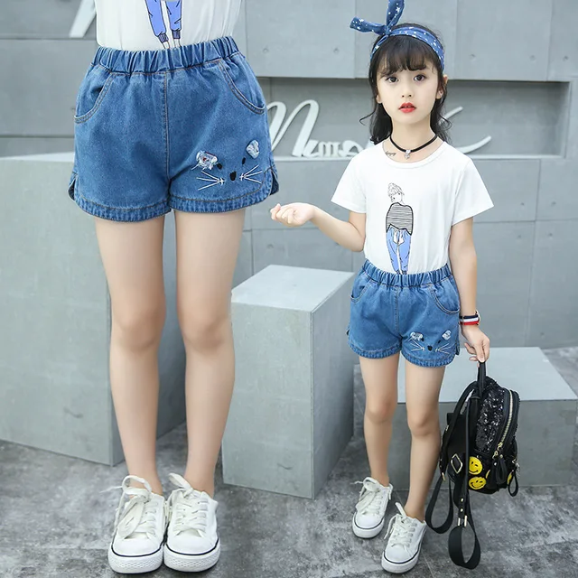 Teen girls in denim shorts criticising Teen girls in denim shorts