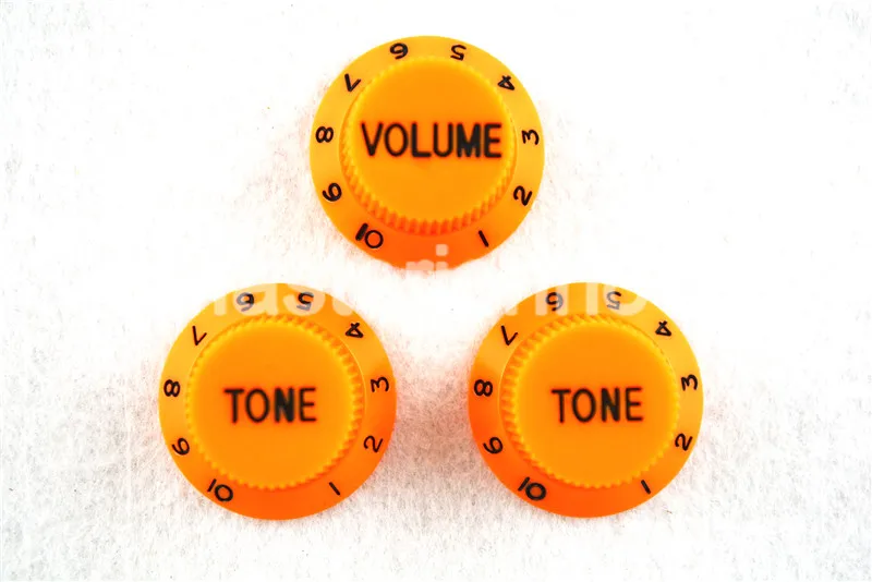 1 Set of Electric Guitar Control Knobs Orange With Black Paint 1 Volume