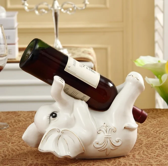 

Porcelain Lying Elephant Baby Figurine Red Wine Bottle Rack Decorative Ceramics Barware and Tableware Craft Ornament Accessories