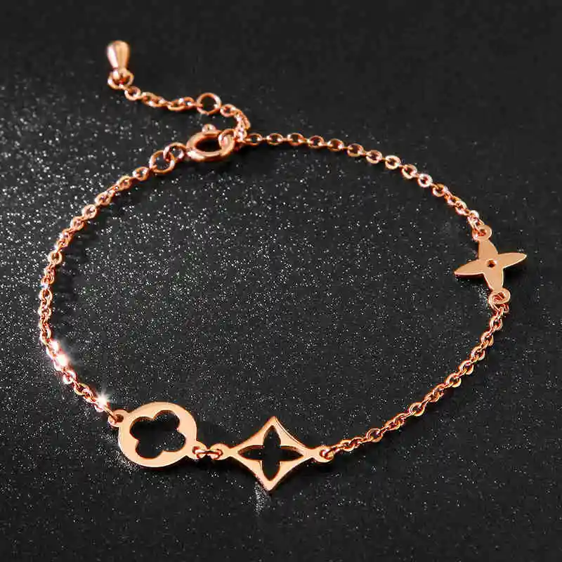 

Top Quality 18KGP Rose Titanium Steel Lucky Clover Bracelet Fashion Brand Lady's Bangle Jewelry Free Shipping(GB034)