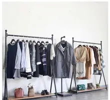 Special Offers Clothing display rack of real wood floor clothes shop. Central island is hanging shelf. Contracted combination.1119 Special Offers Clothing display rack of real wood floor clothes shop. Central island is hanging shelf. Contracted combination.1119