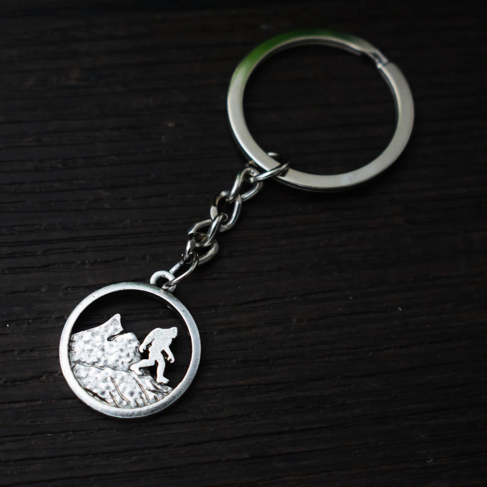 

Sanlan 12pcs antique silver plated bigfoot keychain Sasquatch jewelry