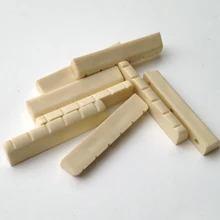 2 pcs/set Acoustic Guitar Wooden Guitar Emulation Beef Bone Strings Bridge Pillow(1 pcs Bridge 1 pcs Pillow)