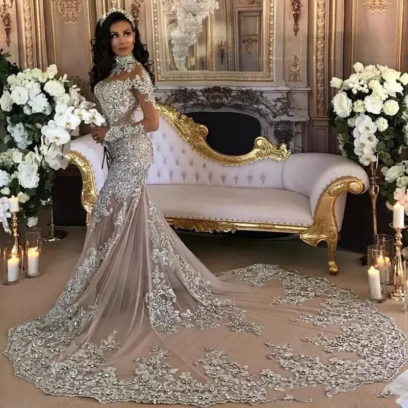 

Dubai Arabic Mermaid Wedding Dresses 2020 Sexy Bling Beaded Lace Applique Wedding Gowns Illusion Long Sleeves Bride Dress