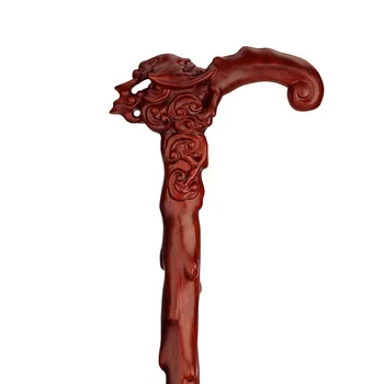 

The old wood carved stick blessing in front of red sandalwood wood stick mahogany cane for the elderly