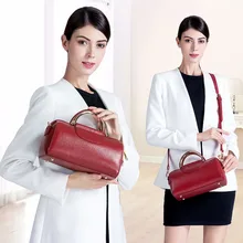Luxury novel pillow-shaped designer genuine leather women handbags high quality simple casual round hard handle women bag