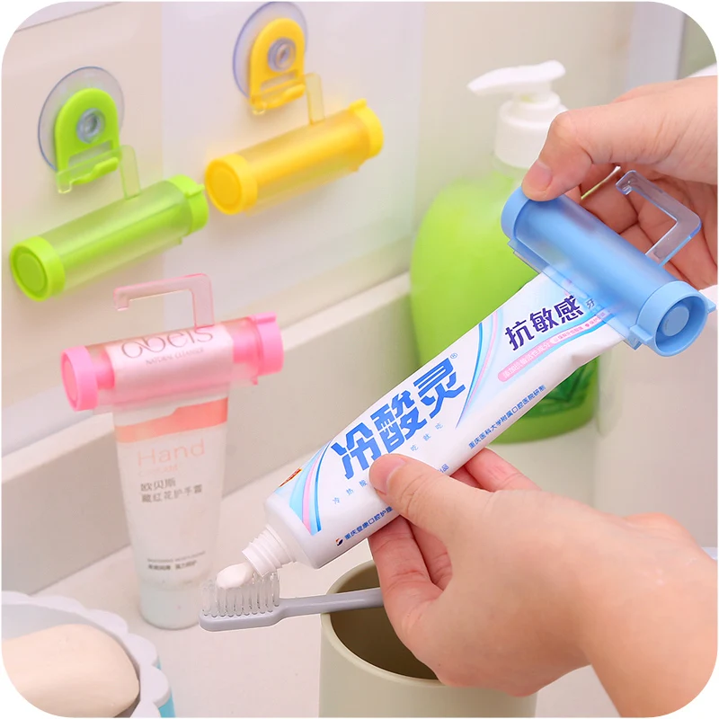 HOT Bathroom Home Tube Rolling Holder Creative Multipurpose Toothpaste Dispenser Bathroom Accessories Manual Syringe Gun Dispens