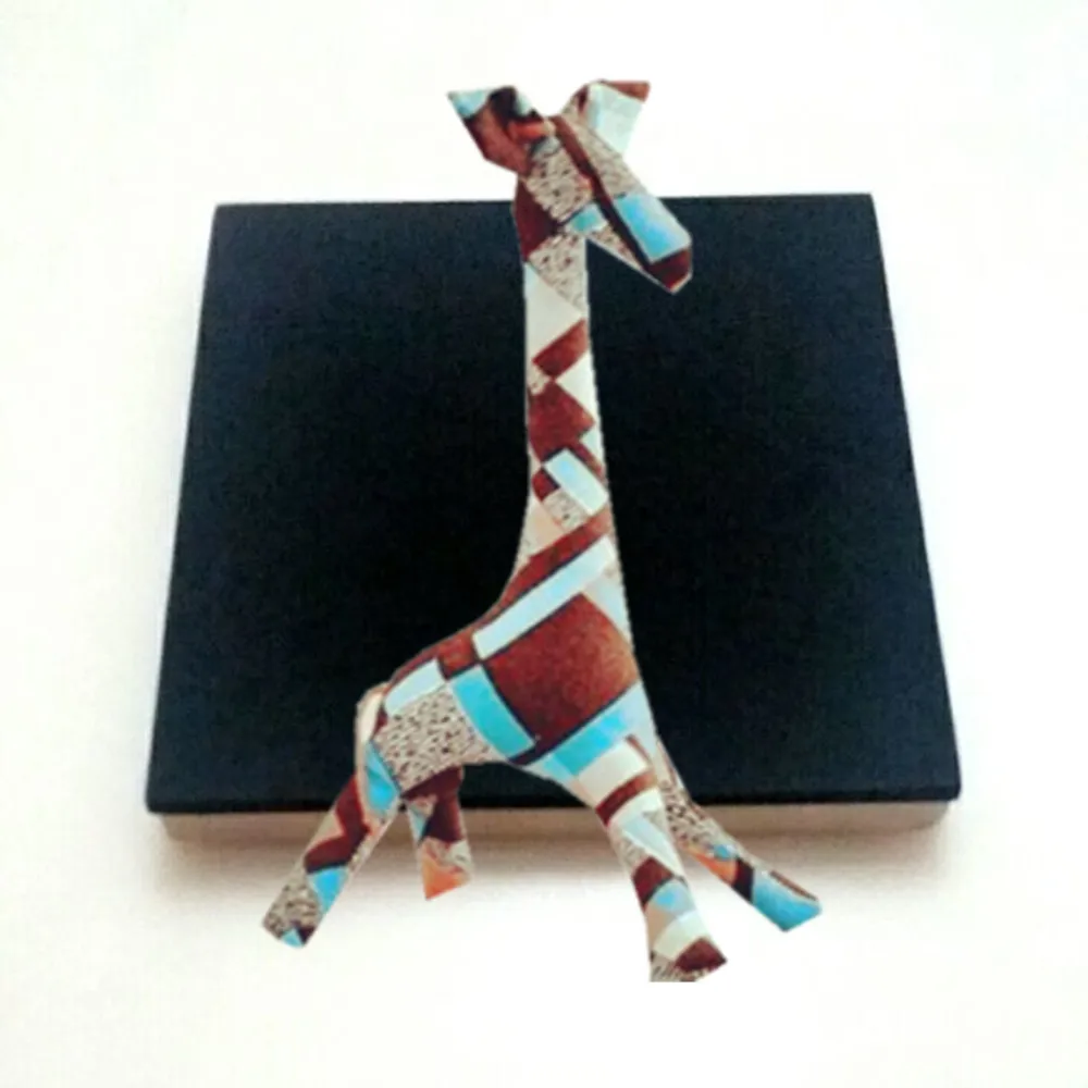 

wooden cutting die is used to make giraffe dolls work in big shot machine