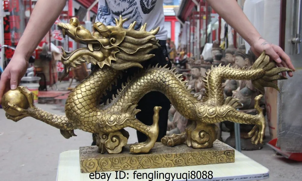 

Chinese Bronze Copper Fenghshui Auspicious Fly Dragon Hold Bead Statue Sculpture Medicine copper Decoration real Brass