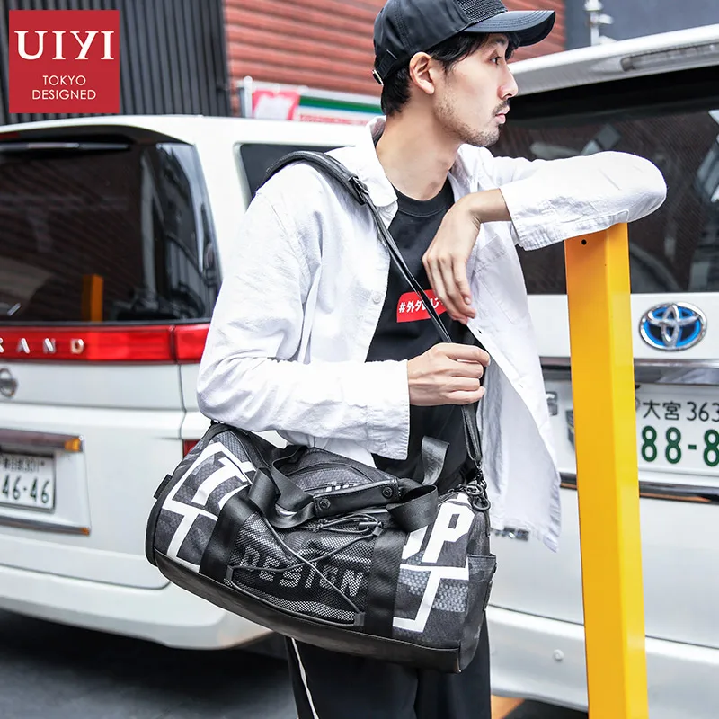 

UIYI Brand 2018 Male Waterproof Large Bag With Shoes Pocket Travel bag Men/Women Fashion Duffle Bag Travel Handbags For Teenager