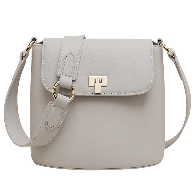 

Women's new leather lock simple bucket type shoulder bag Various leather back buckle bag oblique type shoulder bag