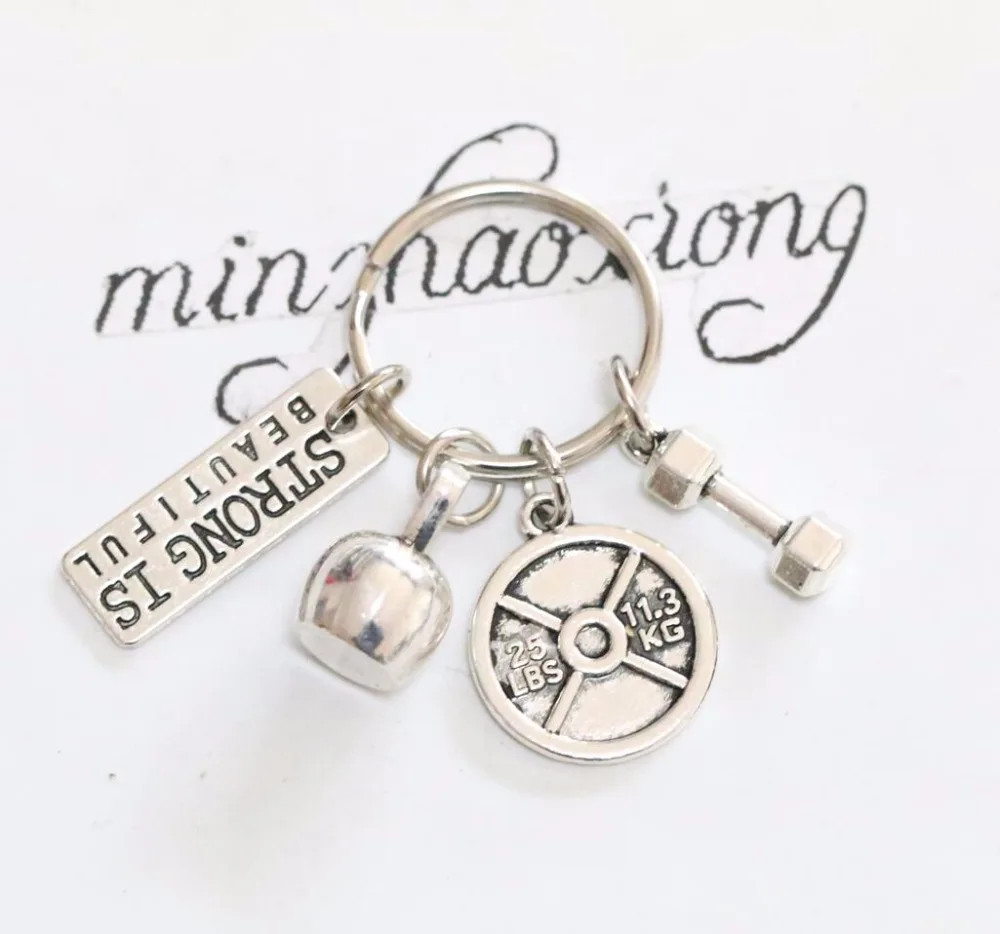

Strong Is Beautiful! - Bodybuilding Fitness Keychain With Dumbbell