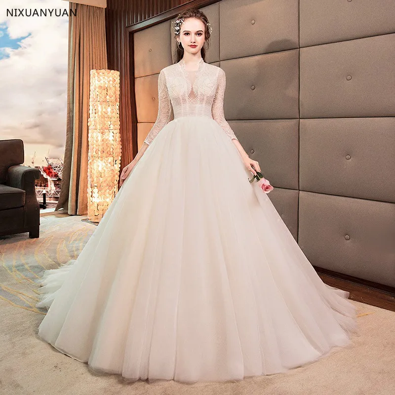 

Fashion New High-end Wedding Dress The Bride Luxury Long Sleeved Deep V-neck Lace Beading Court Train Wedding Gown Custom Made