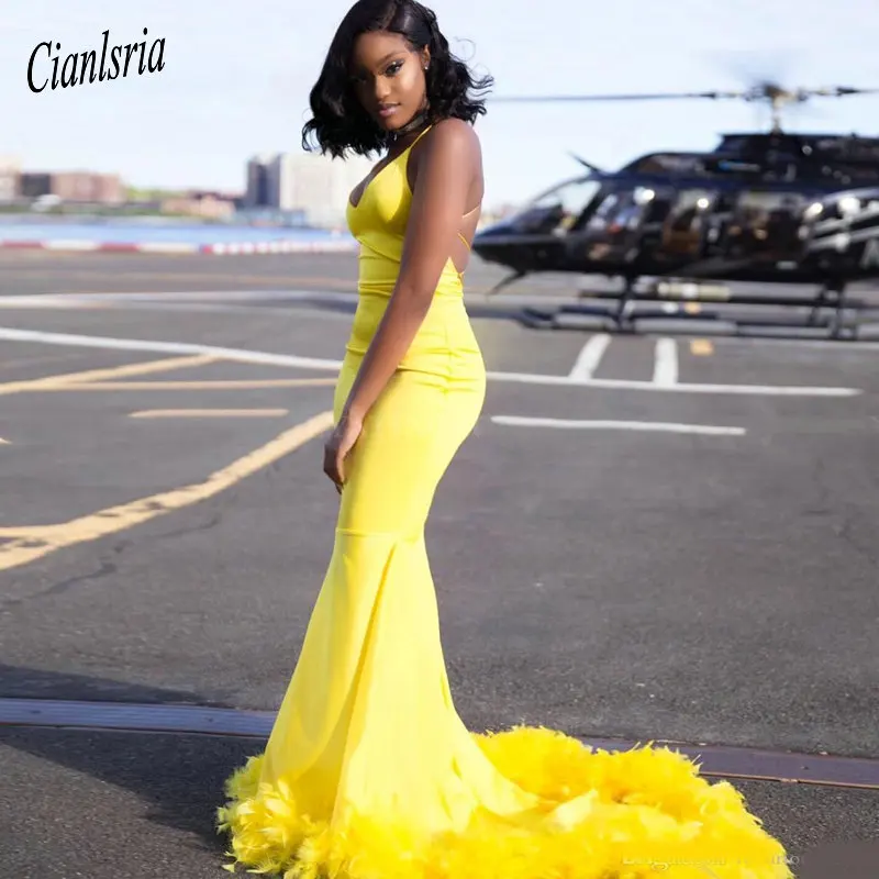

Sexy Criss Cross Straps Open Back Mermaid Yellow Prom Dress with Feather Train V-Neck Black Girls Long Graduation Dresses 2019